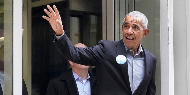 Former President Barack Obama waves to the crowd after casting his ballot at an early voting site Monday, Oct. 17, 2022, in Chicago. (AP Photo/Charles Rex Arbogast)