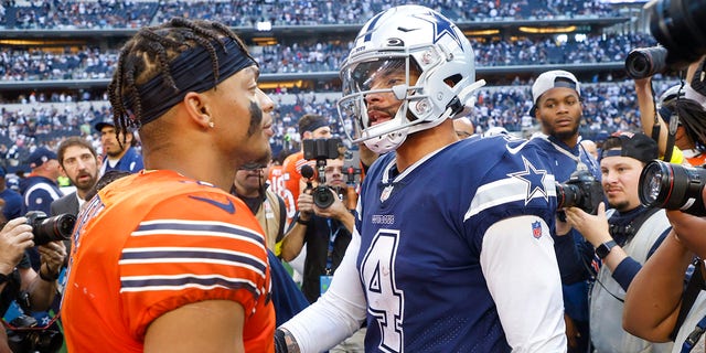 Dallas Cowboys' Dak Prescott, right, talks to Chicago Bears' Justin Fields after their game on Oct. 30, 2022, in Arlington, Texas.