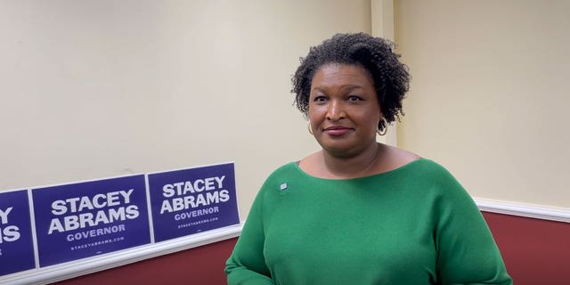 Democratic Georgia gubernatorial nominee Stacey Abrams speaks with Fox News' Brandon Gillespie following a rally with the Asian-American community in Gwinnett County, Georgia on October 7, 2022.