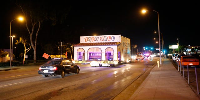 The original Taco Bell restaurant, located in Downey, was moved via truck to the company's headquarters in Irvine. The first location of the massive fast food chain closed long ago, but the company wanted to preserve the building. A truck carries the restaurant, known as ''Numero Uno,'' down Firestone Blvd. in Downey, Calif., in Nov. 2015.