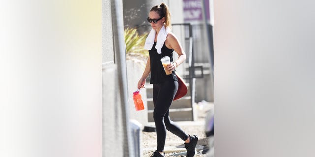 Olivia carried a Harry Styles branded reusable bottle to the gym in September. 