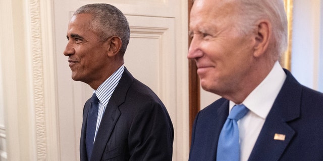 Former President Obama and President Biden arrive at a ceremony to unveil the official Obama White House portraits at the White House on Sept. 7, 2022, in Washington, D.C.