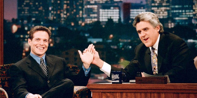Actor Scott Wolf with host Jay Leno during an interview on November 25, 1996.