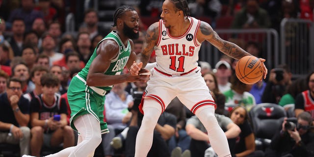 DeMar DeRozan #11 of the Chicago Bulls dribbles against Jaylen Brown #7 of the Boston Celtics during the first half at United Center on October 24, 2022 in Chicago, Illinois.