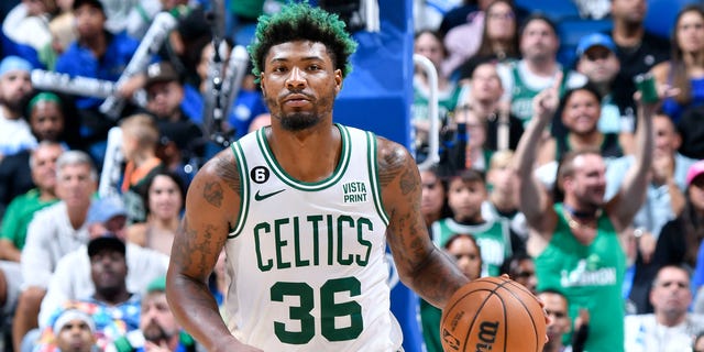 Marcus Smart #36 of the Boston Celtics handles the ball during the game against the Orlando Magic on October 22, 2022 at Amway Center in Orlando, Florida.