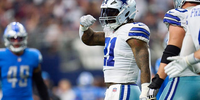Ezekiel Elliott #21 of the Dallas Cowboys celebrates after scoring a touchdown against the Detroit Lions during the second half of the game at AT&amp;amp;T Stadium on October 23, 2022, in Arlington, Texas.