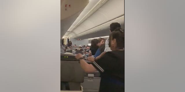 A United Airlines flight attendant was taken to a nearby hospital after an incident with a customer on the plane.