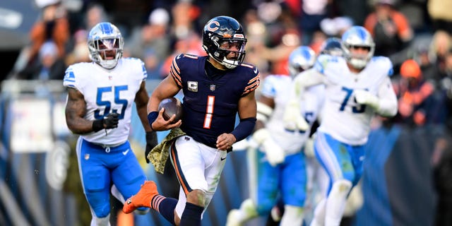 Justin Fields of the Chicago Bears runs for a touchdown during the fourth quarter against the Detroit Lions at Soldier Field on Nov. 13, 2022, in Chicago.