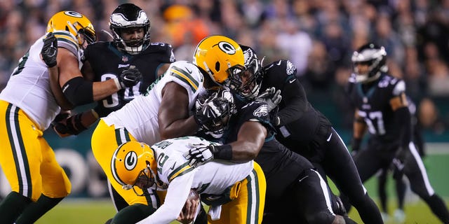 Fletcher Cox #91 of the Philadelphia Eagles sacks Aaron Rodgers #12 of the Green Bay Packers during the second quarter at Lincoln Financial Field on November 27, 2022 in Philadelphia, Pennsylvania.