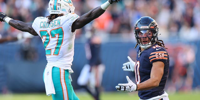 Chase Claypool, #10 of the Chicago Bears, reacts as a pass is broken up by Keion Crossen, #27 of the Miami Dolphins, during the fourth quarter at Soldier Field on Nov. 6, 2022 in Chicago.