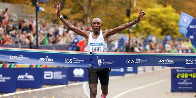 Evans Chebet of Kenya crosses the finish line first in the men's division of the New York City Marathon, Nov. 6, 2022, in New York.