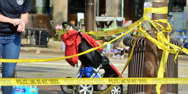 A stroller and other items remain near the scene of the shooting in Highland Park, Illinois, on July 5, 2022. (Jacek Boczarski/Anadolu Agency via Getty Images)