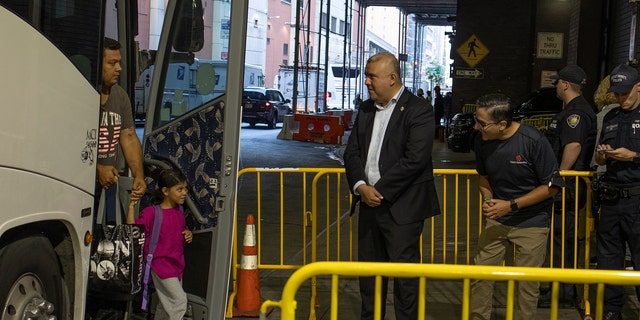 City officials greet migrants arriving on buses from Texas on August 29, 2022 at the Port Authority bus station in midtown New York City, New York. (Photo by Andrew Lichtenstein/Corbis via Getty Images)