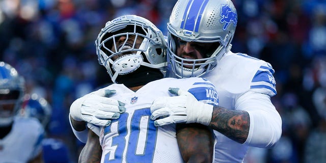 Detroit Lions running back Jamaal Williams (30) celebrates after scoring a touchdown during the first half of a game against the New York Giants Nov. 20, 2022, in East Rutherford, N.J. 