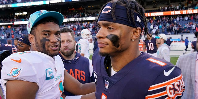 Miami Dolphins quarterback Tua Tagovailoa, left, and Chicago Bears quarterback Justin Fields congratulate each other after the Dolphins beat the Bears, 35-32, Nov. 6, 2022, in Chicago.