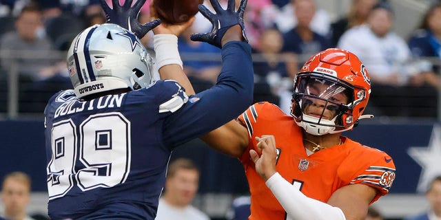 Dallas Cowboys' Chauncey Golston is called for roughing the passer on Chicago Bears' Justin Fields, Sunday, Oct. 30, 2022, in Arlington, Texas.