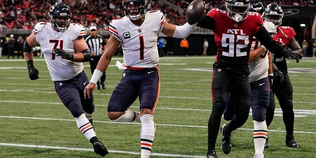 Chicago Bears quarterback Justin Fields runs into the end zone for a touchdown against the Falcons, Sunday, Nov. 20, 2022, in Atlanta.