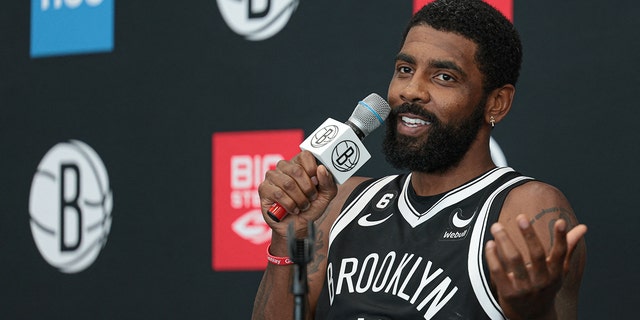Brooklyn Nets guard Kyrie Irving talks to the media.
