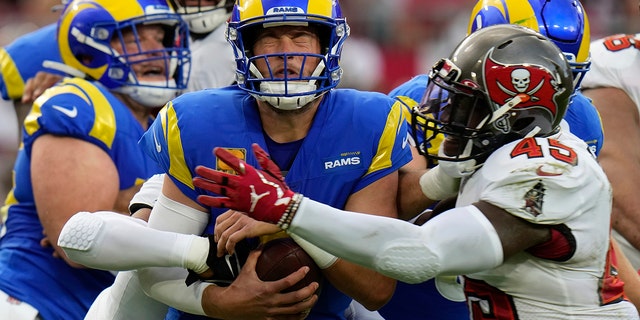 Los Angeles Rams quarterback Matthew Stafford, #9, is sacked by Tampa Bay Buccaneers linebacker Devin White, #45, during the first half of an NFL football game between the Los Angeles Rams and Tampa Bay Buccaneers, Sunday, Nov. 6, 2022, in Tampa, Florida.