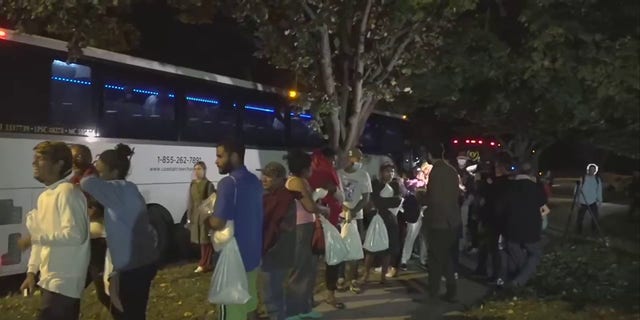 A bus carrying migrants arrived in Washington, D.C., near Vice President Kamala Harris' residence, Thursday, Oct. 6, 2022.