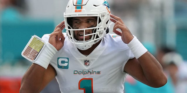 Miami Dolphins quarterback Tua Tagovailoa, #1, makes a call at the line of scrimmage during the first half against the Houston Texans at Hard Rock Stadium in Miami Gardens, Florida, Nov. 27, 2022.