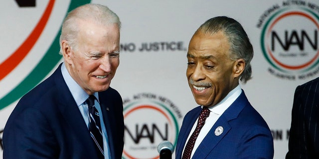 The Rev. Al Sharpton, right, introduces Democratic presidential candidate former Vice President Joe Biden at the National Action Network South Carolina Ministers' Breakfast, Wednesday, Feb. 26, 2020, in North Charleston, S.C.