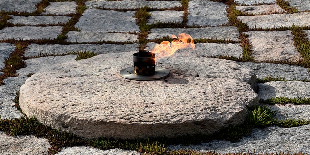 The John F. Kennedy Eternal Flame burns at the grave site of former President John F. Kennedy and his wife, Jacqueline Kennedy Onassis, at Arlington National Cemetery in Virginia, near Washington, D.C.