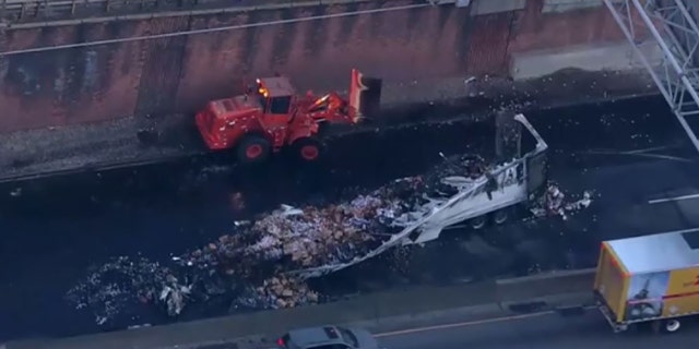 The wreckage from a fiery crash remained on the Cross Bronx Expressway early Tuesday.