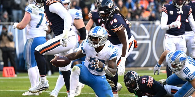 Jamaal Williams (30) of the Detroit Lions celebrates after scoring a touchdown during the fourth quarter against the Chicago Bears at Soldier Field on Nov. 13, 2022, in Chicago.