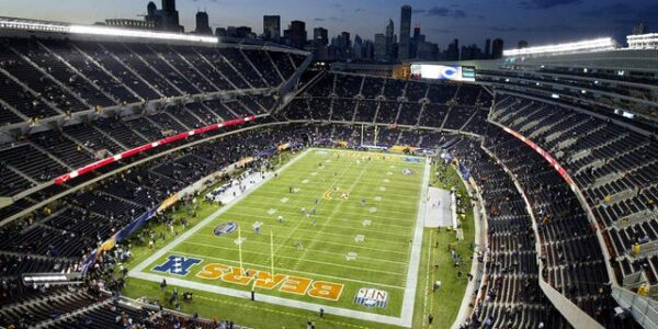 Packers and Bears fans fight in upper deck of Soldier Field, Green Bay supporter pushed down stairs