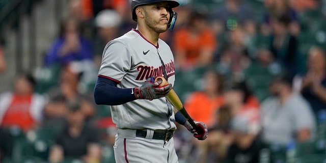 Minnesota Twins' Carlos Correa heads to the dugout after striking out against the Orioles on May 2, 2022, in Baltimore.