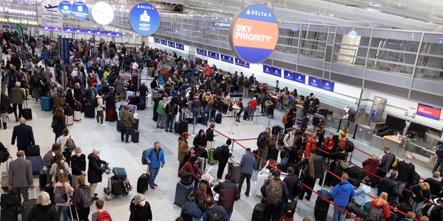 Travelers wait in line to check-in for their flights at Terminal 1 ahead of the Christmas Holiday at MSP Airport in Bloomington, Minn., on Thursday, Dec. 22, 2022.