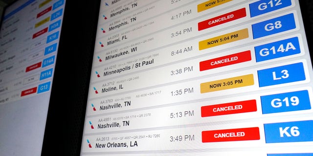 American Airlines flight information screens display flight information, including canceled and delayed flights, at O'Hare International Airport in Chicago, Thursday, Dec. 22, 2022.