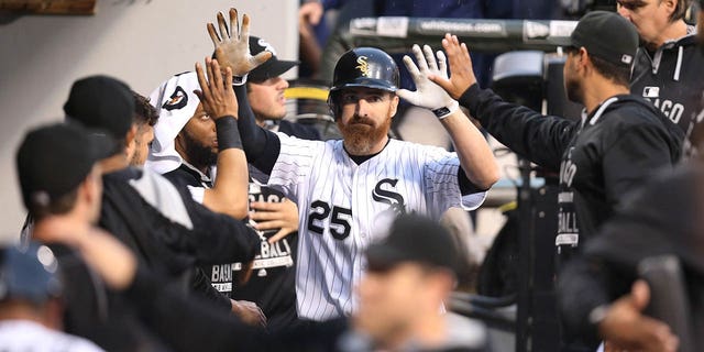 The Chicago White Sox's Adam LaRoche, #25, is congratulated by teammates after his two-run double in the first inning against the Toronto Blue Jays at U.S. Cellular Field in Chicago on Wednesday, July 8, 2015.