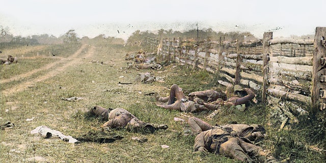 A colorized photograph of Confederate soldiers killed during the Battle of Antietam in 1862. Allen Guelzo believes that despite deep political divisions, "the fundamental unity of the American people" is stronger now than when Southern states seceded in 1861.