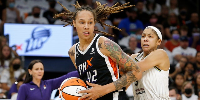 Phoenix Mercury center Brittney Griner, #42, drives past Chicago Sky forward Candace Parker, #3, during the first half of Game 1 of the WNBA Basketball Finals, Sunday, Oct. 10, 2021, in Phoenix.