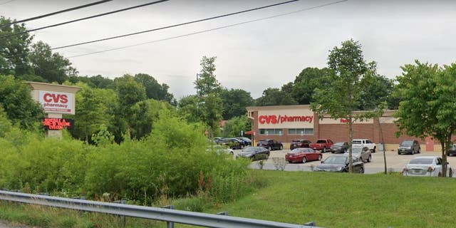 A Google Earth image shows the CVS Pharmacy at 1910 Crain Highway in Bowie, Maryland.