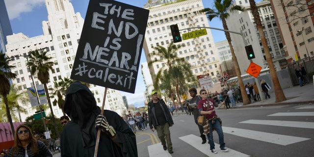 A demonstrator holds a "Calexit" sign during the Women's March in Los Angeles Jan. 21, 2017, in protest of former President Trump's inauguration. Professor Allen C. Guelzo, an award-winning historian of the Civil War era, noted secessionist proposals have lately emerged from both sides of the aisle.