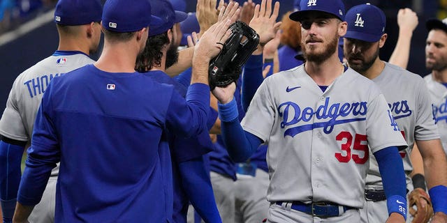 Cody Bellinger, #35 of the Los Angeles Dodgers, is congratulated by teammates after defeating the Miami Marlins at loanDepot park on Aug. 29, 2022 in Miami.