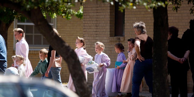 Women and children from the YFZ Ranch, the compound built by polygamist leader Warren Jeffs, are moved by bus to San Angelo, Texas, on Sunday, April 6, 2008. Authorities are investigating allegations of child abuse.  