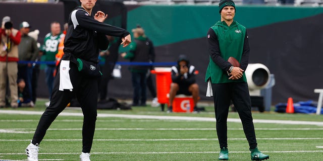 New York Jets quarterback Zach Wilson (2) watches New York Jets quarterback Mike White (5) warm up prior to the National Football League game between the New York Jets and the Chicago Bears on November 27, 2022 at MetLife Stadium in East Rutherford, New Jersey.   