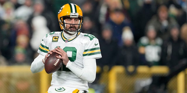 Aaron Rodgers of the Green Bay Packers looks to throw a pass against the Tennessee Titans during the first quarter in a game at Lambeau Field Nov. 17, 2022, in Green Bay, Wis. 