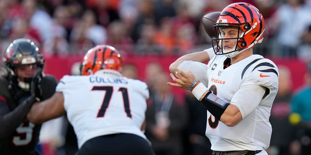 Cincinnati Bengals quarterback Joe Burrow, #9, throws a pass against the Tampa Bay Buccaneers during the first half of an NFL football game, Sunday, Dec. 18, 2022, in Tampa, Florida.
