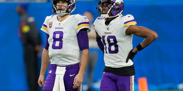 Minnesota Vikings' Kirk Cousins and Justin Jefferson watch a replay during the Lions game, Sunday, Dec. 11, 2022, in Detroit.