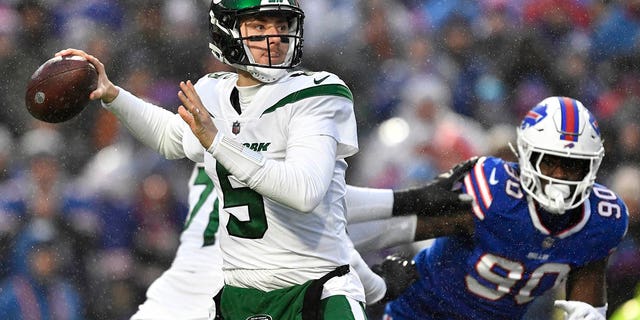New York Jets quarterback Mike White winds up to pass during the first half against the Buffalo Bills, Dec. 11, 2022, in Orchard Park, New York.