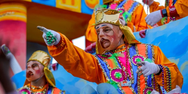 The Krewe of Proteus rolls on the Uptown route with the theme "Divine Tricksters" in New Orleans on February 28, 2022.