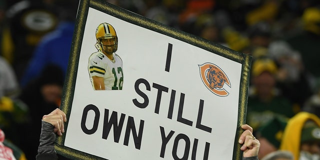 A fan of the Green Bay Packers hold up a sign before the NFL game against the Chicago Bears at Lambeau Field on December 12, 2021, in Green Bay, Wisconsin. 