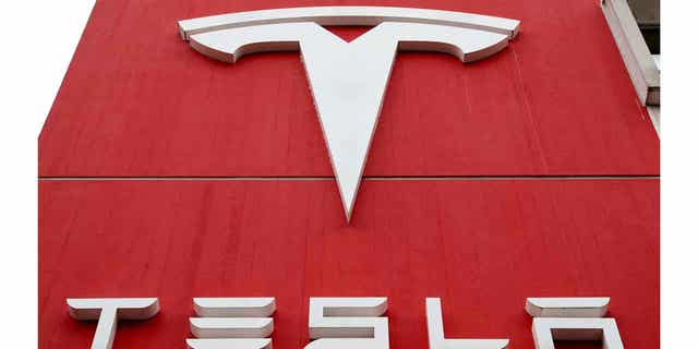 The logo of car manufacturer Tesla is seen at a branch office in Bern, Switzerland October 28, 2020. 