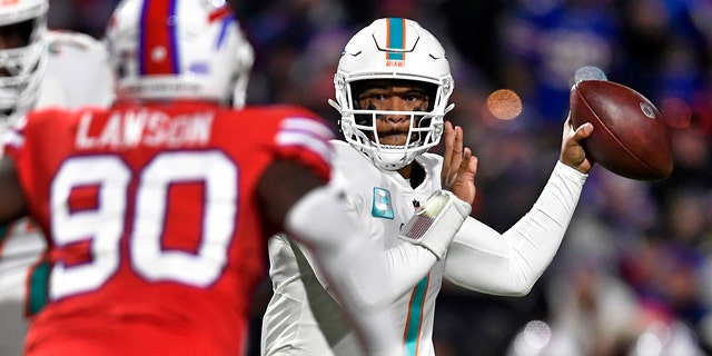 Miami Dolphins quarterback Tua Tagovailoa, #1, throws a pass during the first half of an NFL football game against the Buffalo Bills in Orchard Park, New York, Saturday, Dec. 17, 2022.