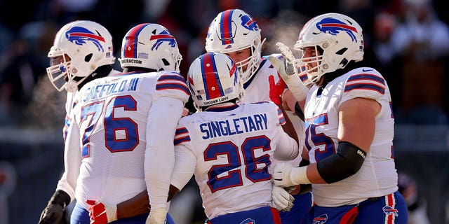 Devin Singletary #26 of the Buffalo Bills celebrates a touchdown during the third quarter in the game against the Chicago Bears at Soldier Field on Dec. 24, 2022 in Chicago, Ill. 